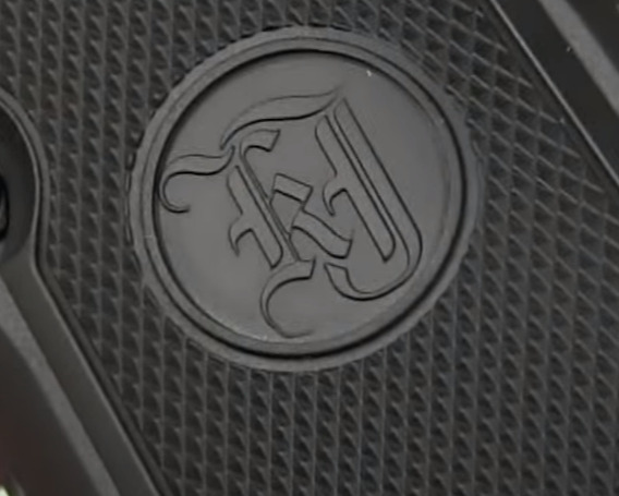 picture of KJ Works logo on the grips of the M9