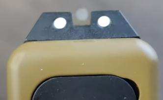 close up picture of umarex glock 19x sights aiming at target