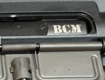 close up shot of VFC BCM AEG mock bolt showing BCM logo