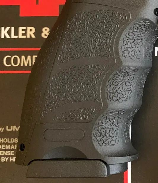 picture of elite force umarex vp9 grips showing stippling and removable straps and side panels