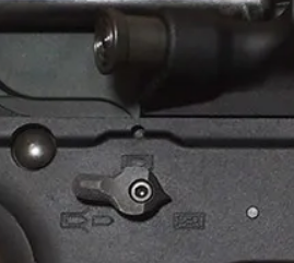 close up picture showing ambidextrous fire selector on sig mcx airsoft gun