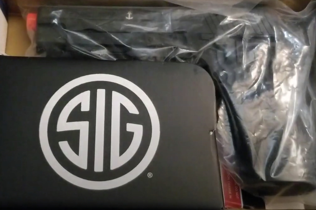 sig sauer p225 mk25 airsoft pistol being unboxed