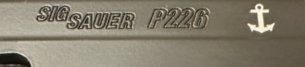 close up of sig sauer  logo and trademarks on sig sauer mk25 airsoft pistol