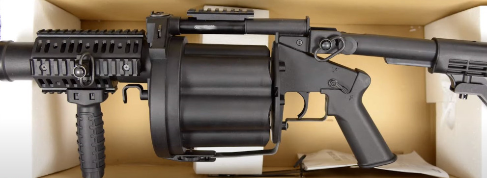 picture of ics mgl resident evil style airsoft grenade launcher being unboxed