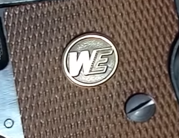 close up picture of we trademark button on we ct25 grip